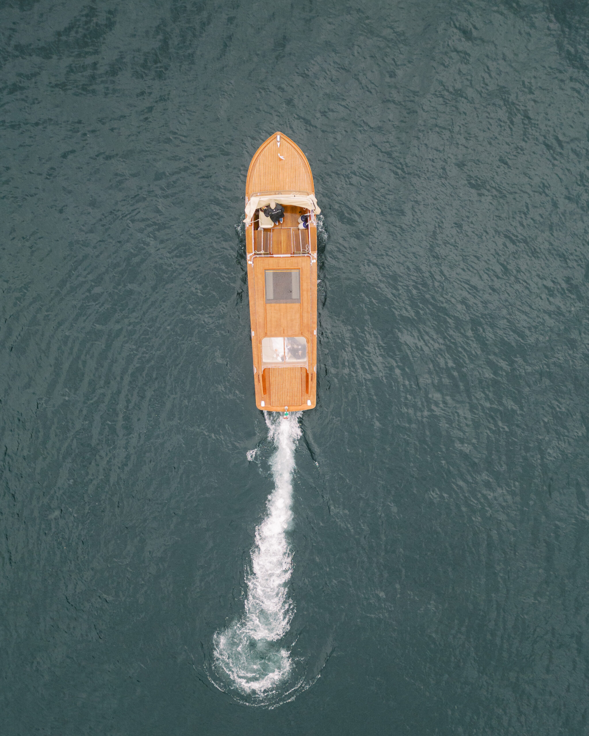 Wedding portraits on boat on Lake Como