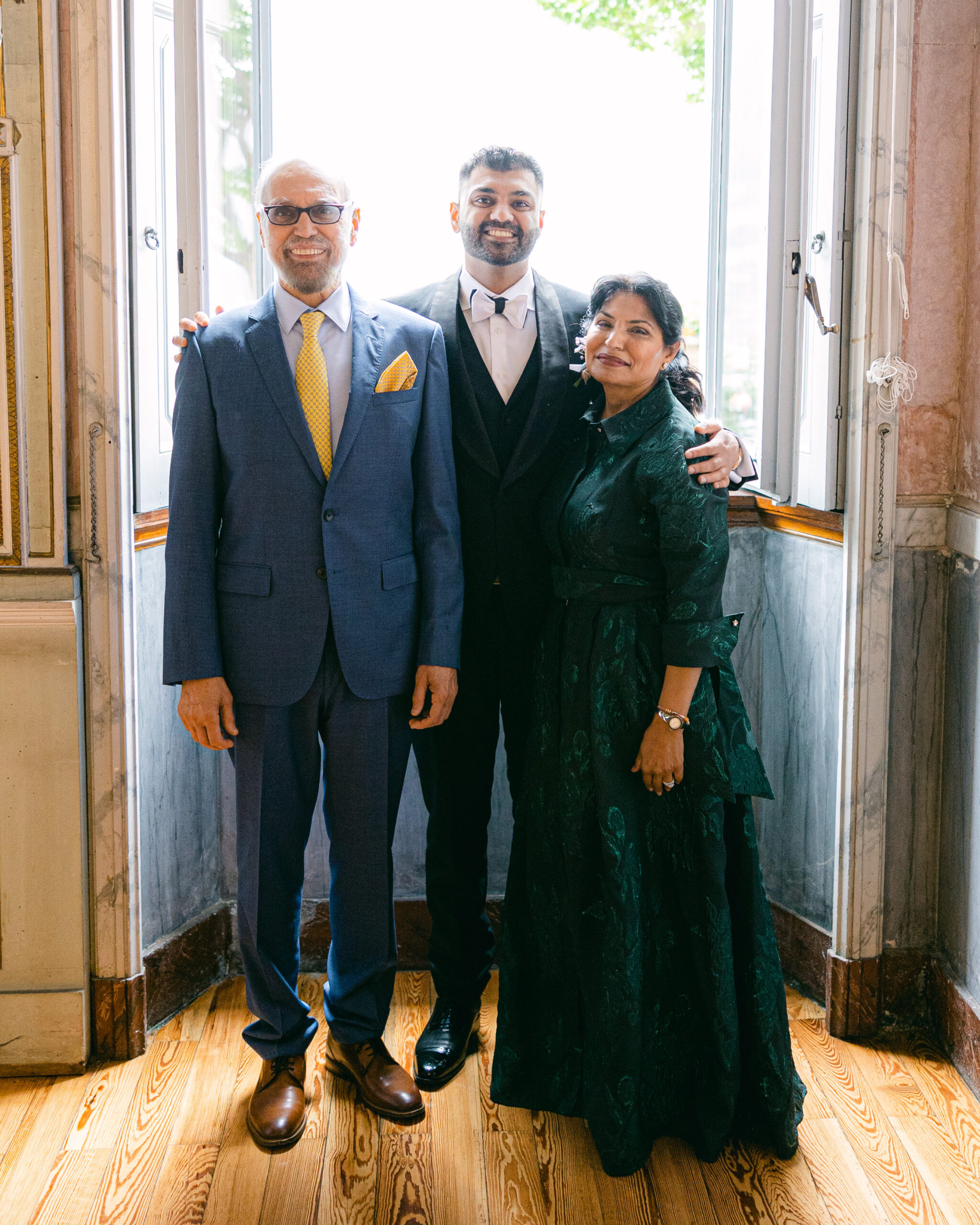 Groom and parents at destination wedding on Lake Como