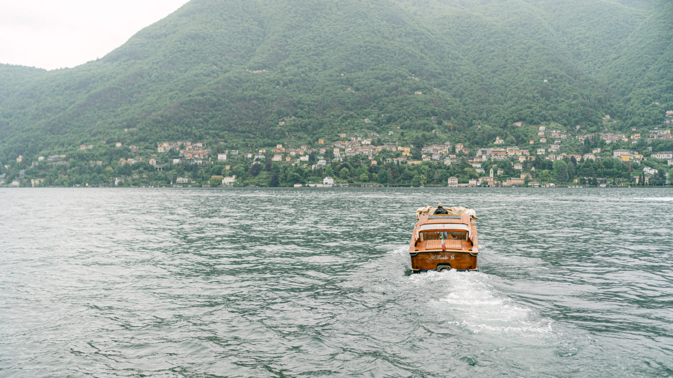 Wedding portraits on boat on Lake Como